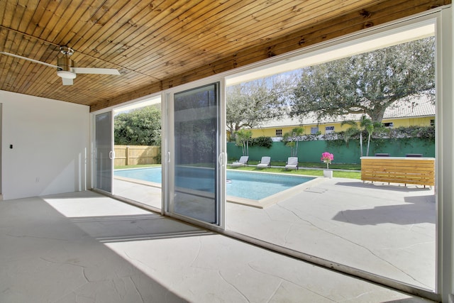 doorway featuring a water view and wood ceiling