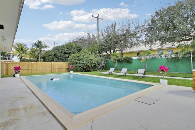 view of pool with a yard, a fenced backyard, a fenced in pool, and a patio