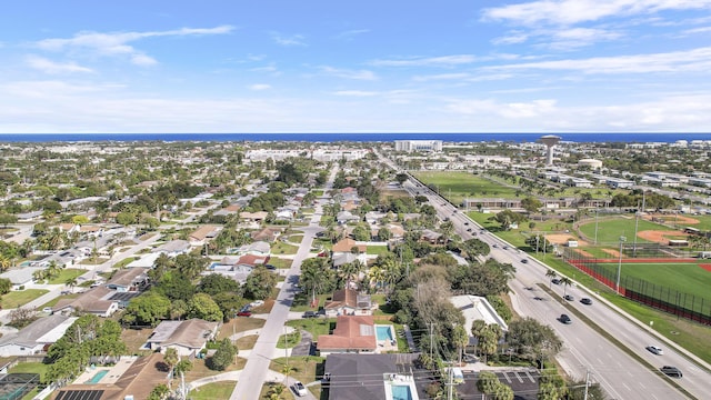 bird's eye view with a water view and a residential view