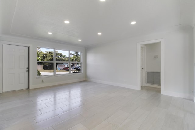 empty room with recessed lighting, visible vents, and baseboards