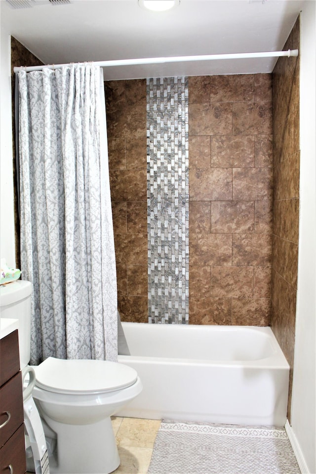 full bathroom with shower / bath combination with curtain, tile patterned floors, vanity, and toilet