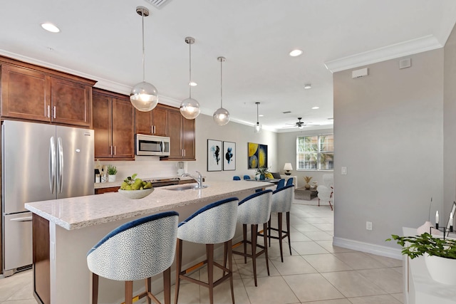 220 S Federal Hwy Unit 4, Lake Worth Beach, FL 33460 - kitchen with appliances with stainless steel finishes, a sink, ornamental molding, a center island with sink, and a ceiling fan