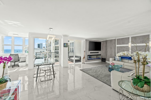 living room featuring marble finish floor, ornamental molding, and a water view