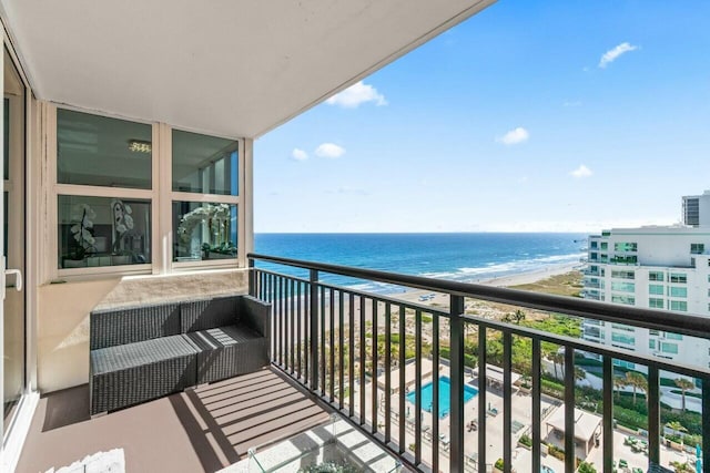 balcony with a view of the beach and a water view