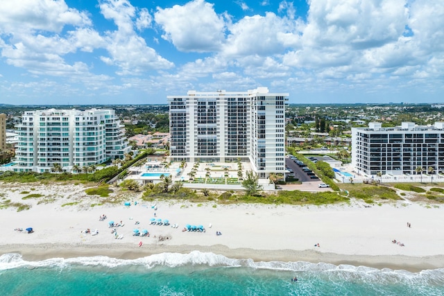 bird's eye view featuring a view of city, a water view, and a view of the beach