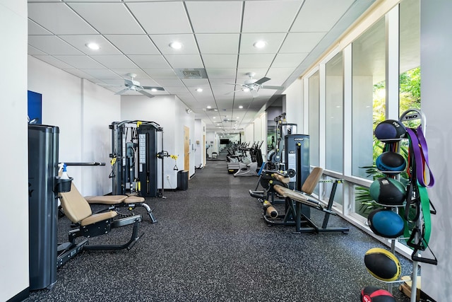 exercise room with a paneled ceiling, visible vents, a ceiling fan, and recessed lighting