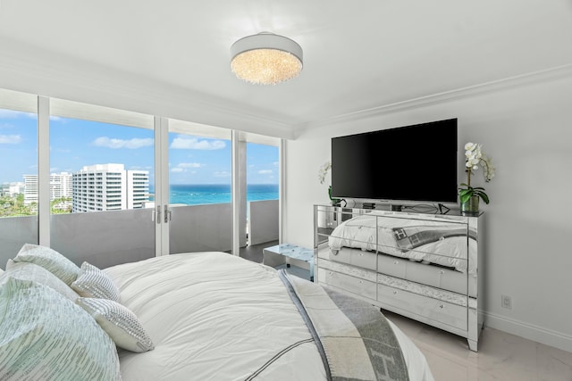 bedroom featuring access to outside, ornamental molding, and baseboards