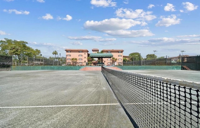 view of sport court with fence