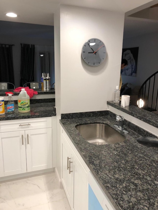 bathroom featuring marble finish floor, recessed lighting, and vanity