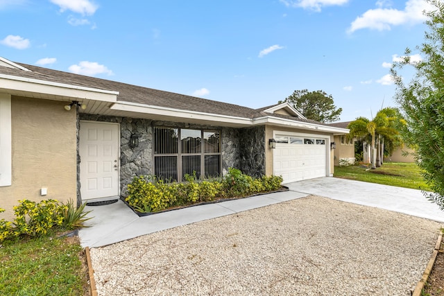 ranch-style home featuring a garage