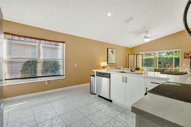 kitchen featuring vaulted ceiling, sink, white cabinetry, dishwasher, and ceiling fan