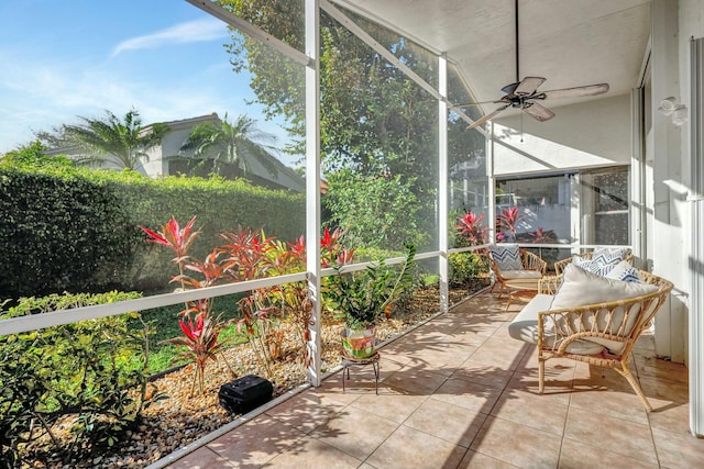 sunroom featuring ceiling fan
