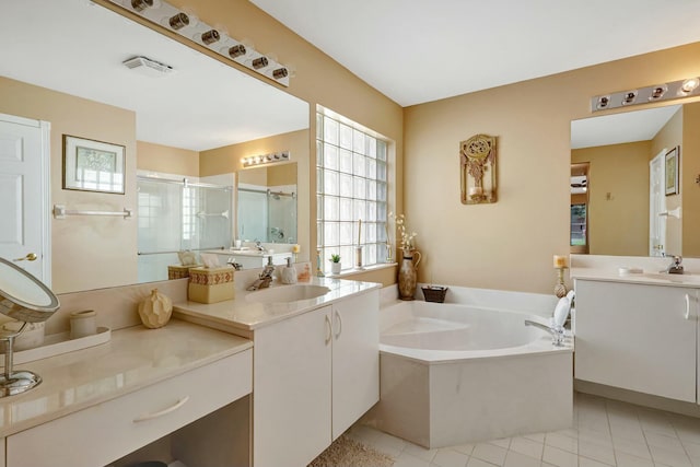 bathroom with vanity, shower with separate bathtub, and tile patterned floors