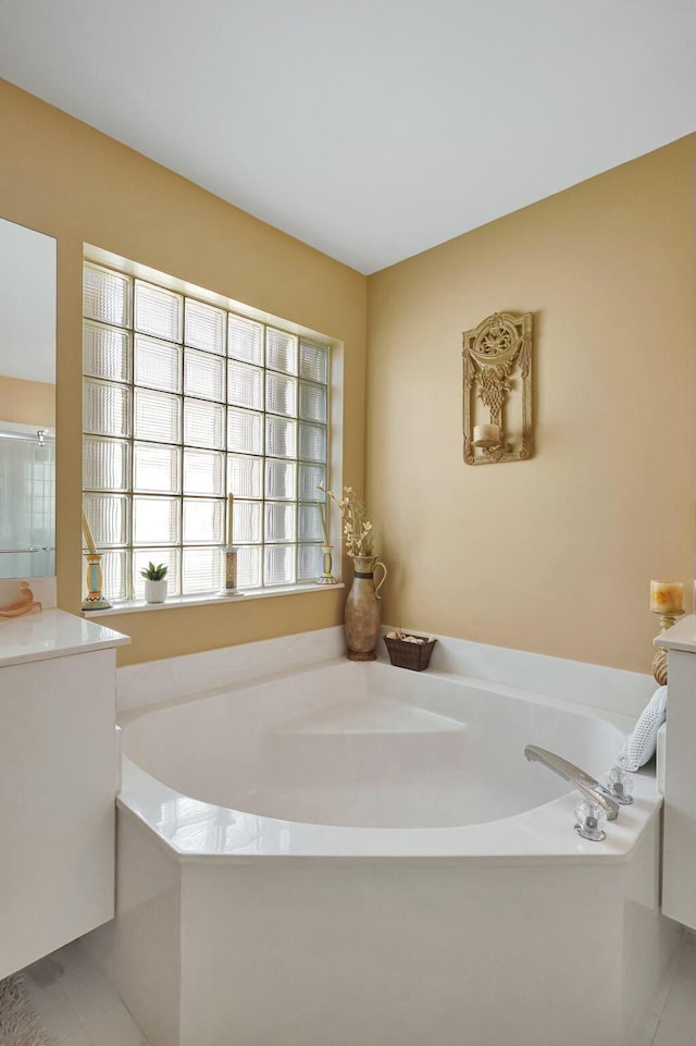 bathroom featuring vanity and a bathing tub