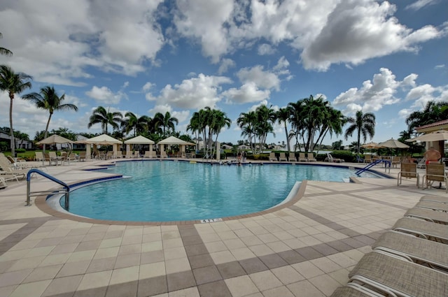 view of swimming pool with a patio and a gazebo