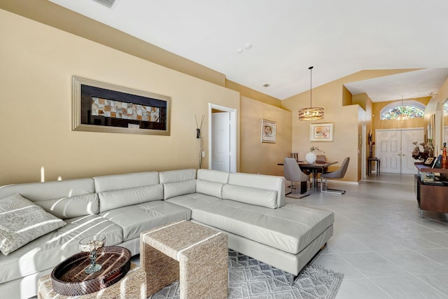 tiled living room featuring lofted ceiling
