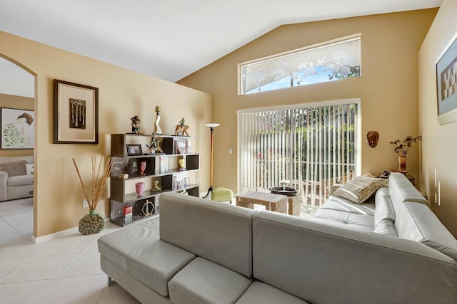 tiled living room with vaulted ceiling