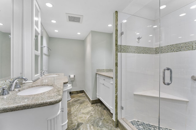 bathroom featuring toilet, vanity, visible vents, marble finish floor, and a shower stall