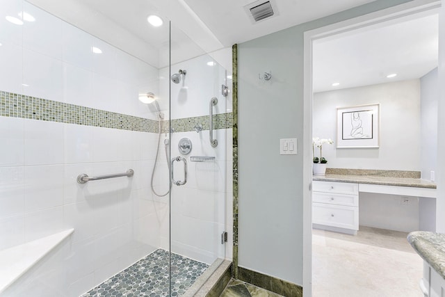 full bath featuring a stall shower, baseboards, visible vents, vanity, and recessed lighting