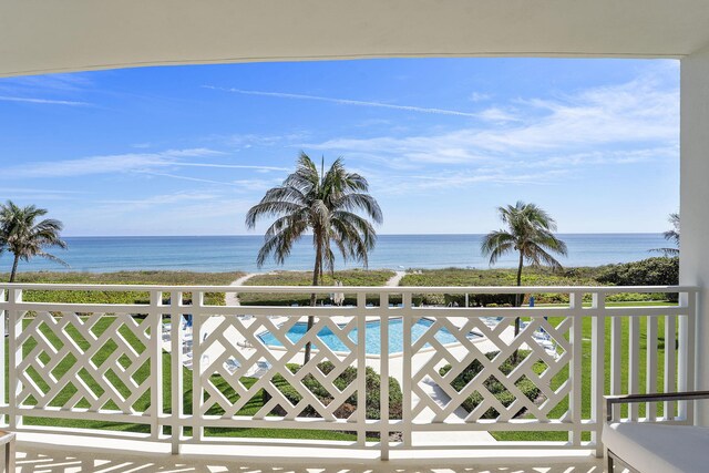 balcony featuring a water view