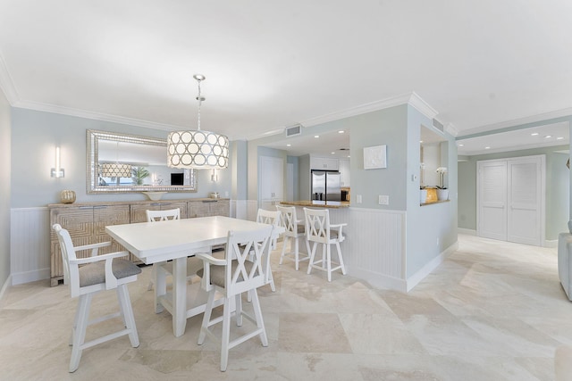 dining space featuring recessed lighting, wainscoting, crown molding, and visible vents