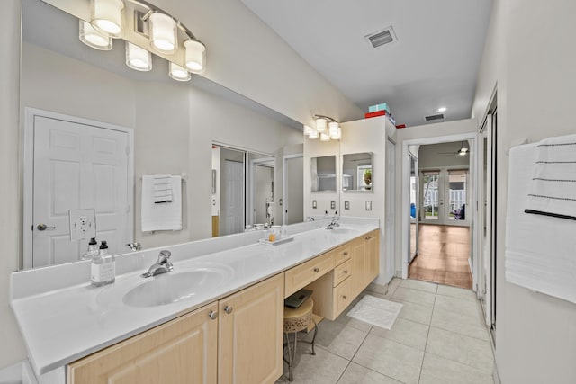 3036 Calle Valencia, West Palm Beach, FL 33409 - full bath with double vanity, tile patterned flooring, a sink, and visible vents