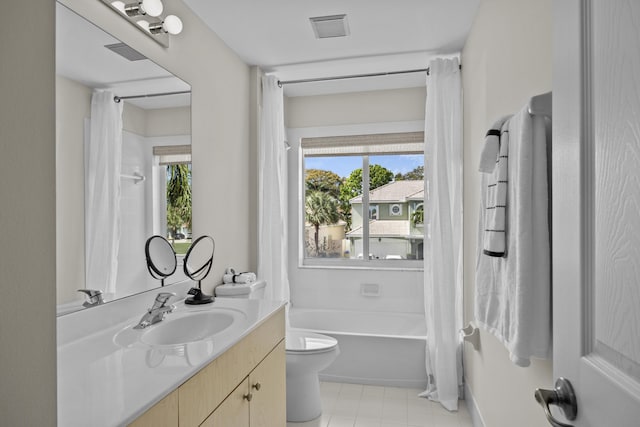 3036 Calle Valencia, West Palm Beach, FL 33409 - bathroom with a healthy amount of sunlight, visible vents, shower / bathtub combination with curtain, and toilet