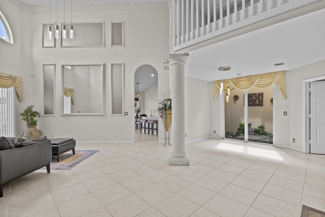 3036 Calle Valencia, West Palm Beach, FL 33409 - foyer with baseboards, visible vents, ornate columns, and light tile patterned floors