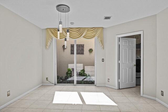 3036 Calle Valencia, West Palm Beach, FL 33409 - unfurnished room featuring light tile patterned floors, baseboards, and visible vents