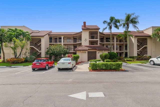 view of property with uncovered parking