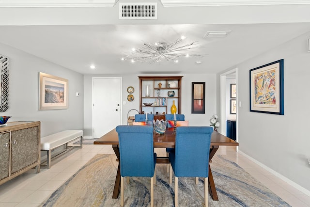 dining space featuring light tile patterned floors, baseboards, and visible vents