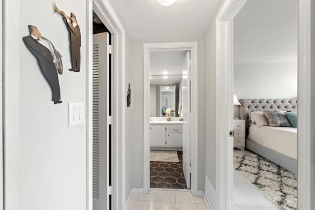 hallway with light tile patterned flooring