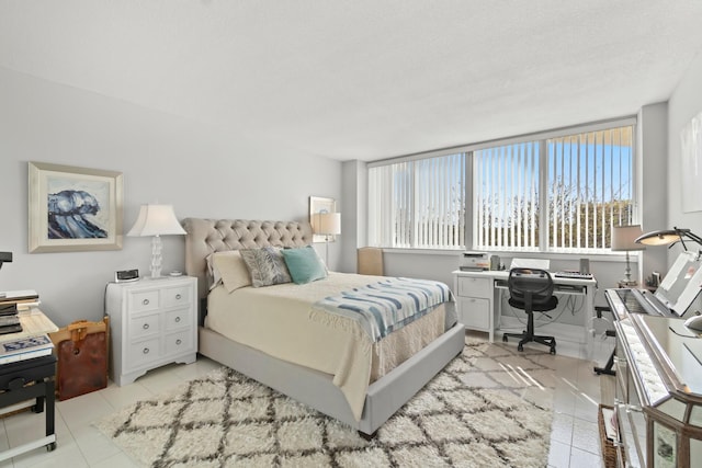 bedroom with light tile patterned flooring