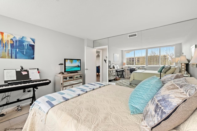 bedroom featuring visible vents