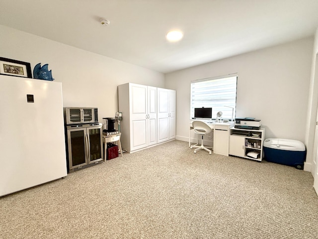 office featuring carpet and beverage cooler