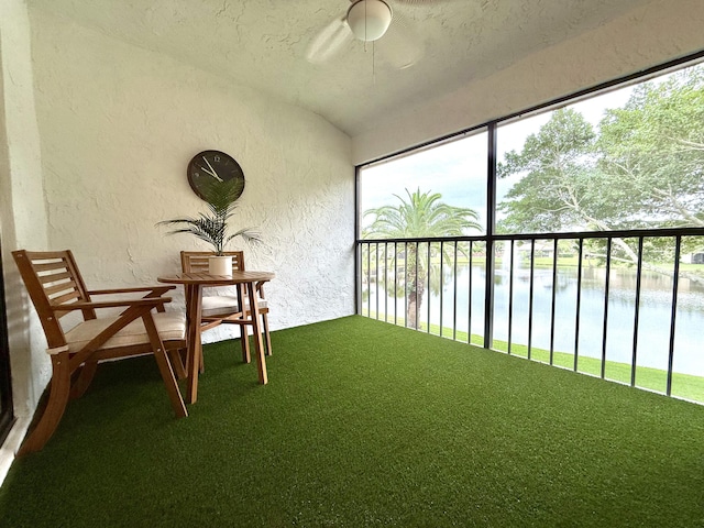 unfurnished sunroom with a water view