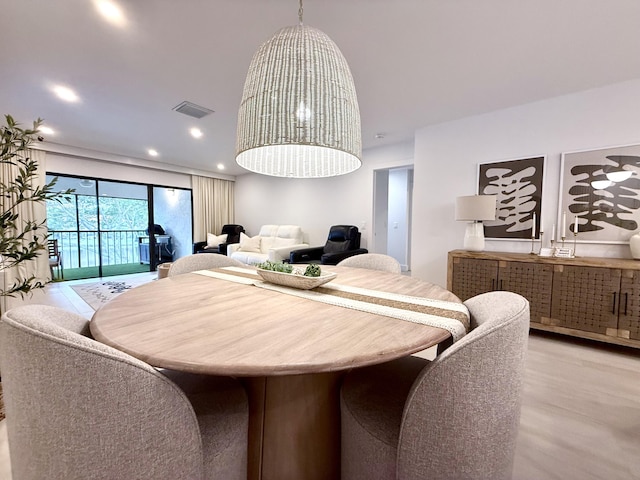 dining area with light wood-type flooring