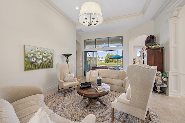 tiled living room featuring crown molding, a notable chandelier, and a towering ceiling