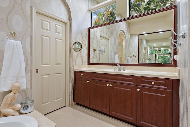 bathroom with tile patterned floors and vanity