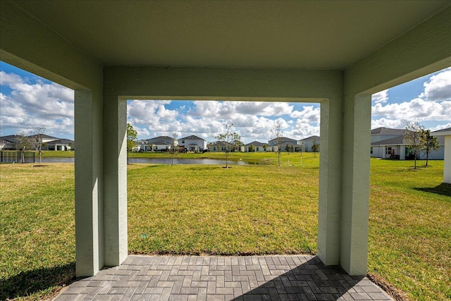 view of yard with a water view and a residential view