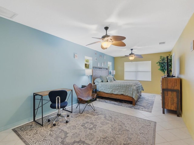 tiled bedroom with ceiling fan