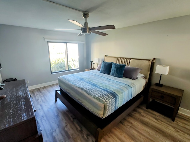 bedroom featuring ceiling fan and wood-type flooring