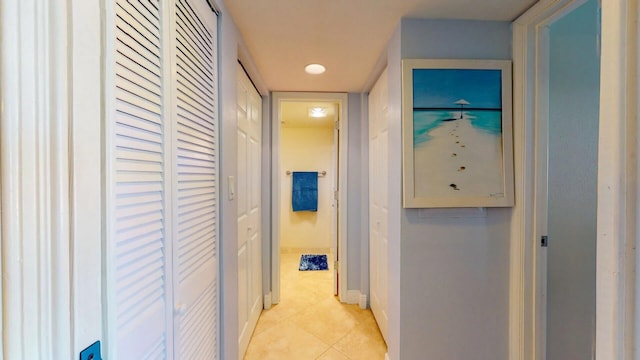 hallway featuring light tile patterned floors