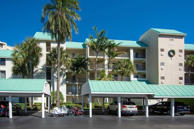 2400 S Ocean Dr Unit 2328, Fort Pierce, FL 34949 - view of building exterior featuring covered parking