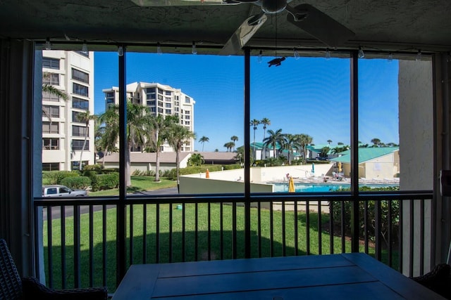 unfurnished sunroom with a water view