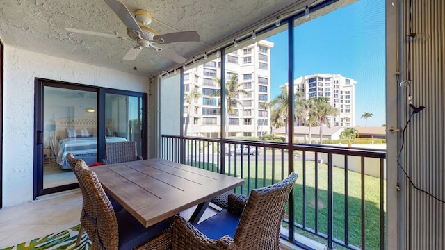 balcony featuring ceiling fan