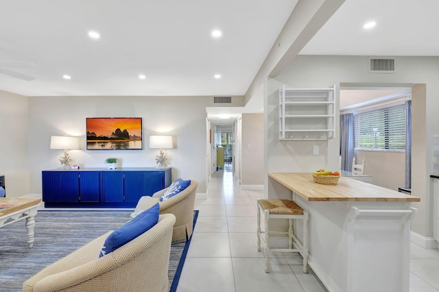 living room with tile patterned flooring