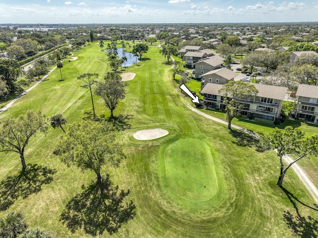 aerial view featuring a water view, a residential view, and golf course view