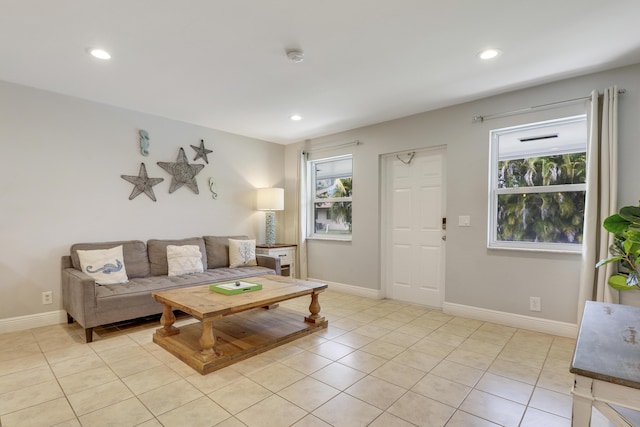 living room featuring a healthy amount of sunlight and light tile patterned floors