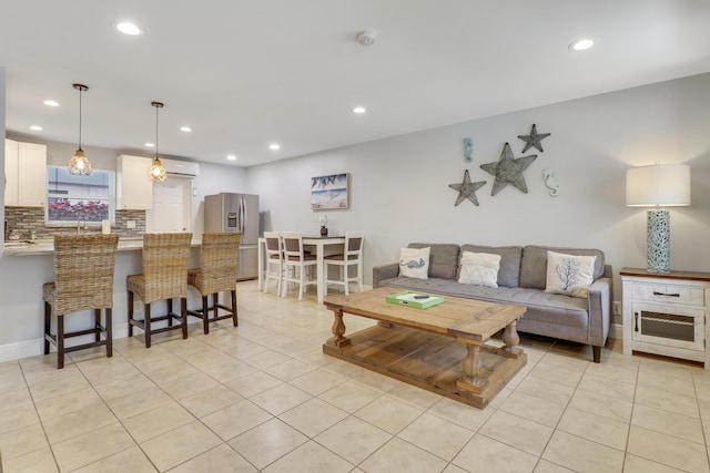 tiled living room with a wall mounted AC